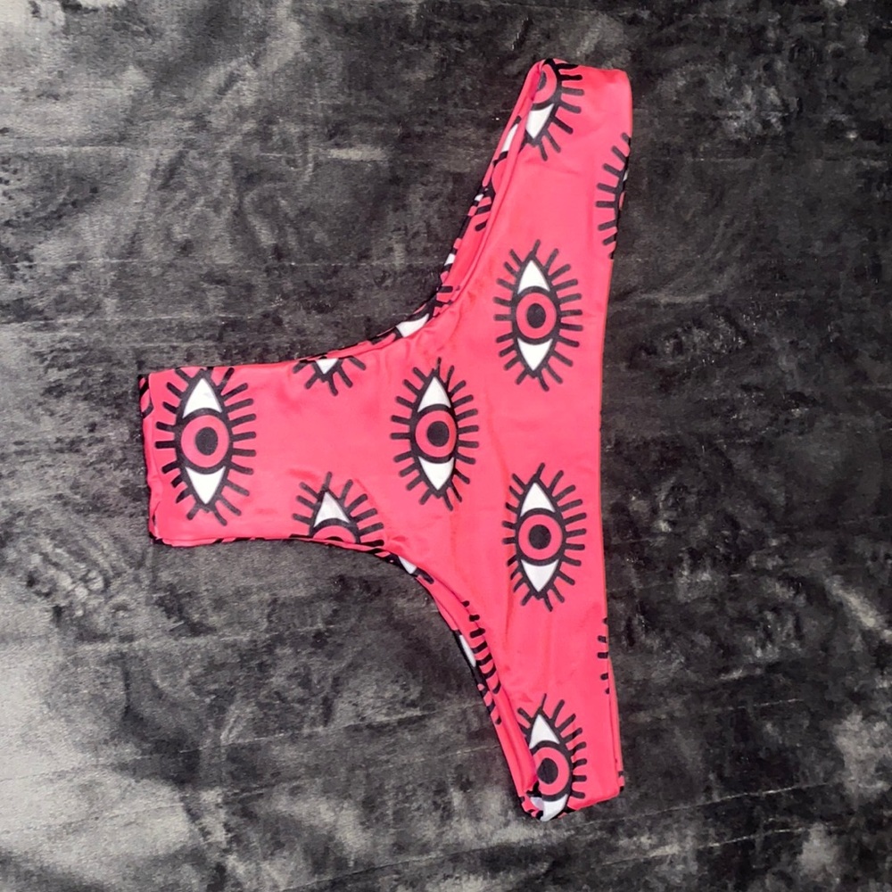 Pink bottom bathing suit with eyes